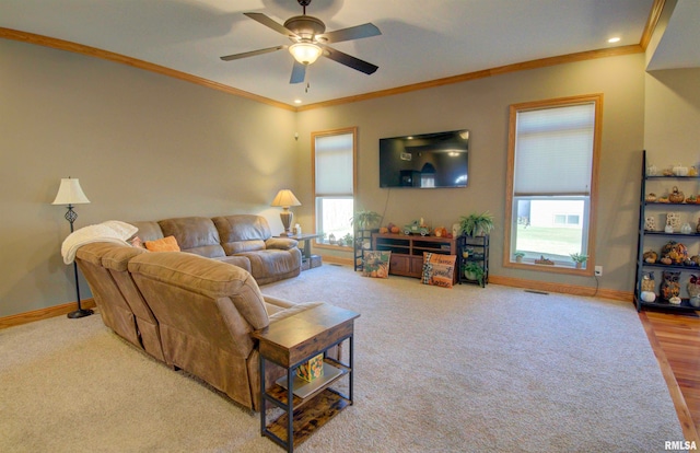 living room with crown molding, hardwood / wood-style flooring, and ceiling fan