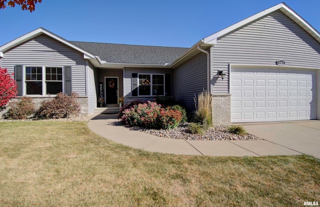 ranch-style home featuring a front yard and a garage