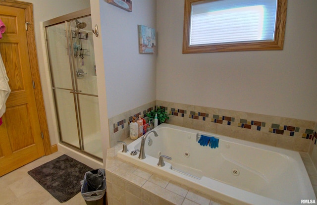 bathroom featuring separate shower and tub