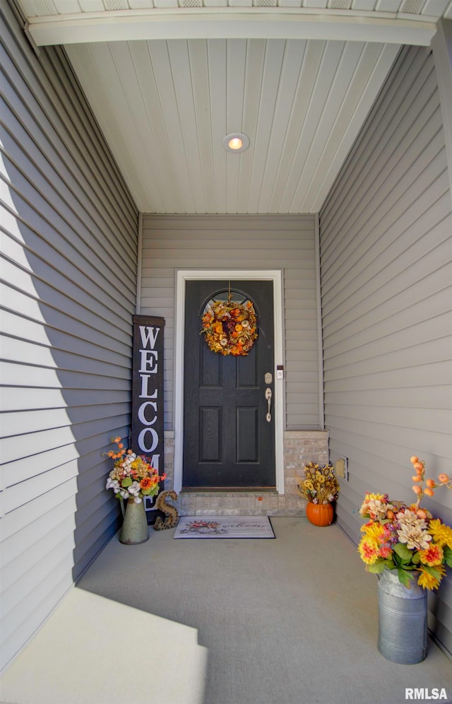 property entrance featuring covered porch