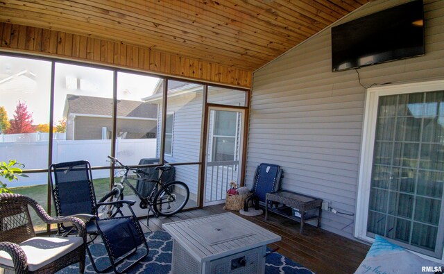 sunroom with wood ceiling and vaulted ceiling