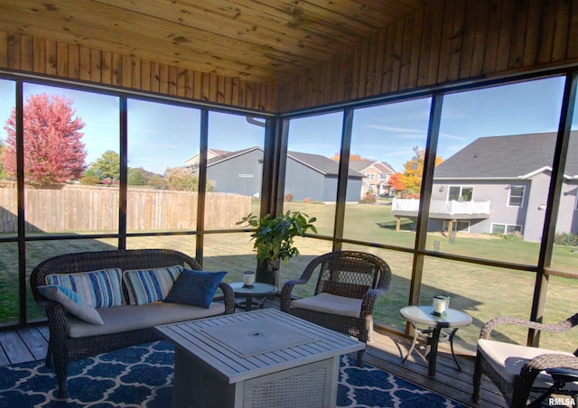 sunroom with wooden ceiling and vaulted ceiling