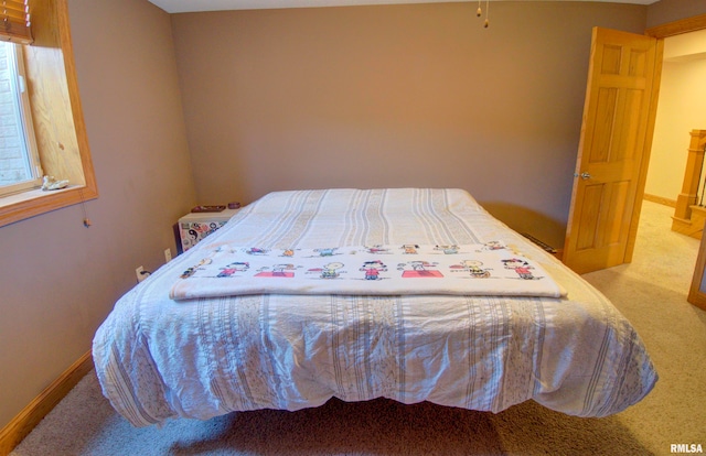 bedroom with light colored carpet