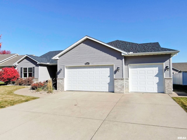 ranch-style house featuring a garage