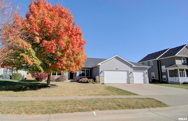 view of front of home featuring a front yard and a garage