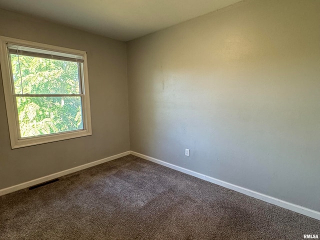 unfurnished room featuring carpet flooring