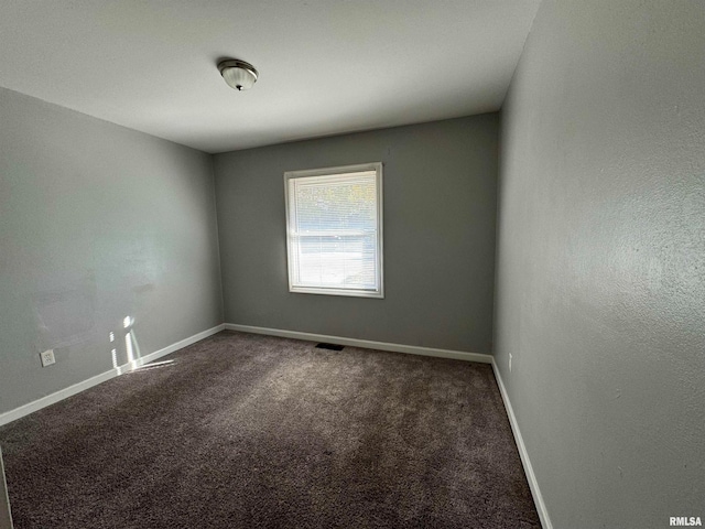 empty room with carpet flooring