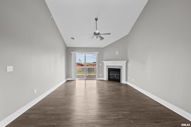 unfurnished living room with dark hardwood / wood-style floors, high vaulted ceiling, and ceiling fan