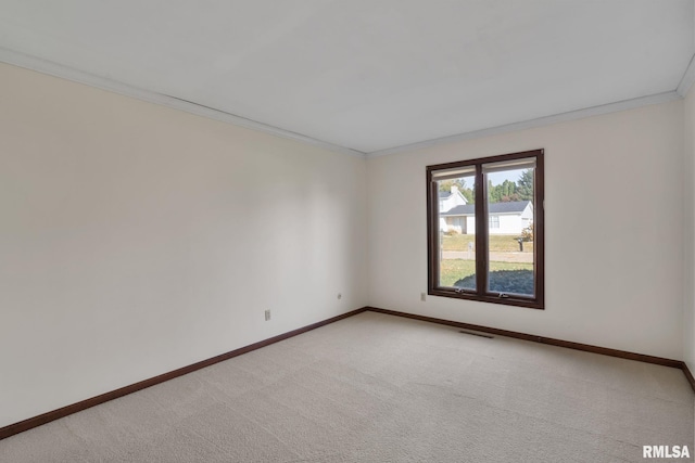 carpeted spare room with ornamental molding