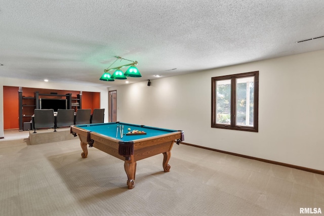 game room featuring light colored carpet, a textured ceiling, and billiards