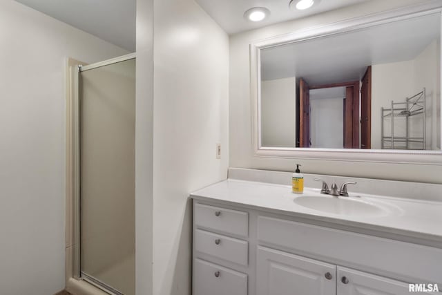 bathroom with vanity and walk in shower