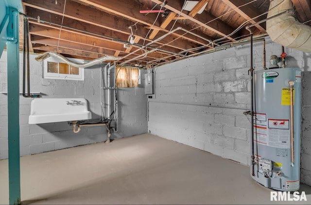 basement featuring electric panel, water heater, and sink