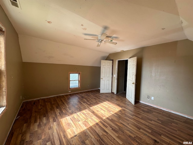 bonus room featuring dark hardwood / wood-style floors, ceiling fan, and vaulted ceiling