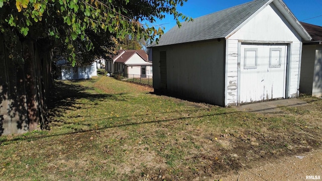 garage featuring a yard