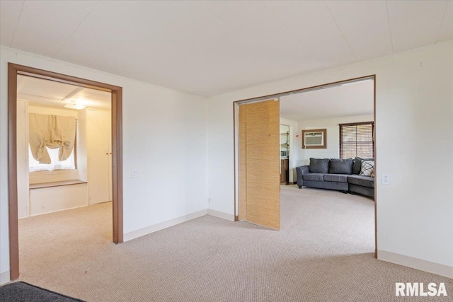 empty room featuring carpet floors and a wall mounted AC