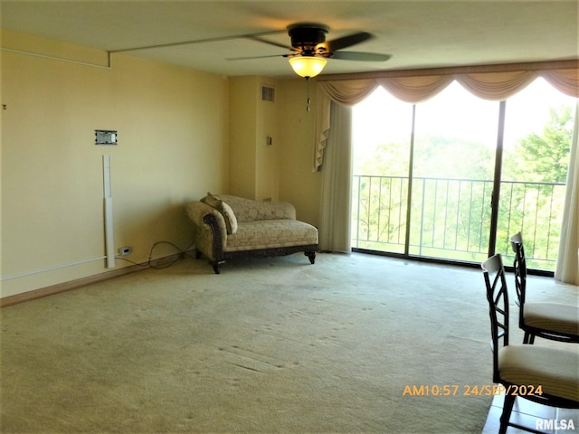 unfurnished room with light carpet, ceiling fan, and plenty of natural light