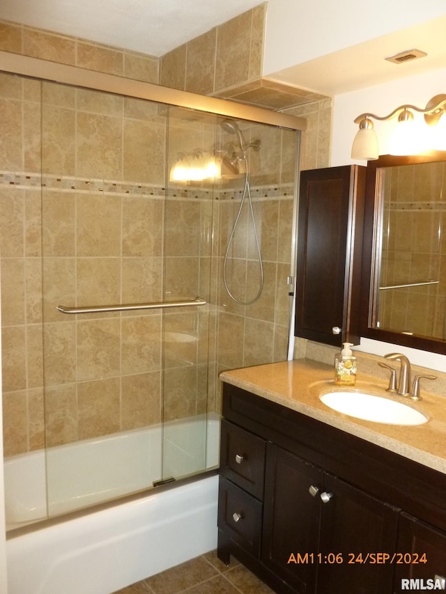 bathroom with vanity, tile patterned floors, and shower / bath combination with glass door