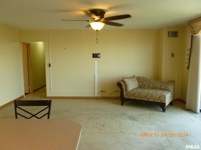 unfurnished room featuring ceiling fan and light colored carpet