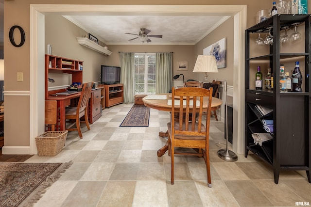 dining space featuring ceiling fan and ornamental molding