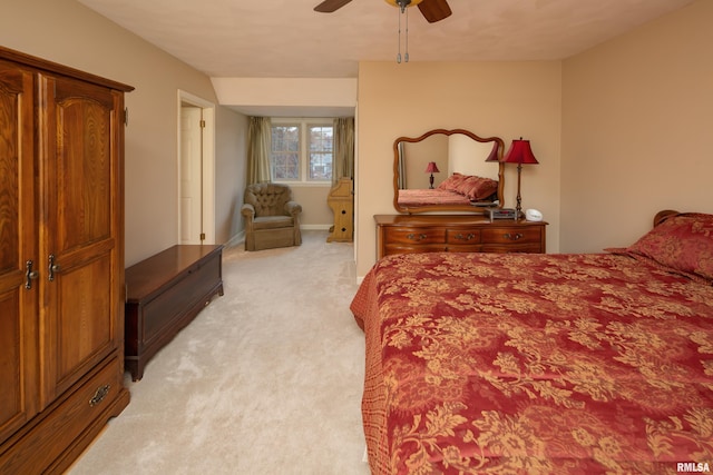 bedroom with ceiling fan and light colored carpet