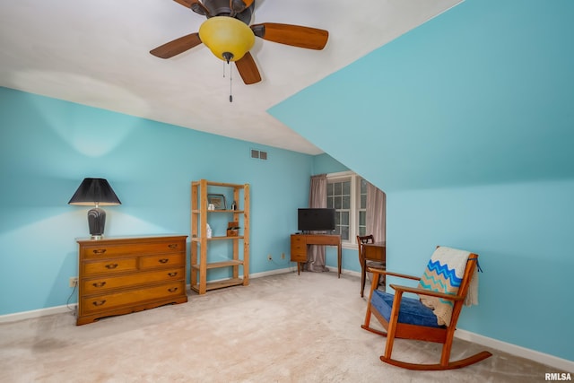 living area with carpet, ceiling fan, and vaulted ceiling