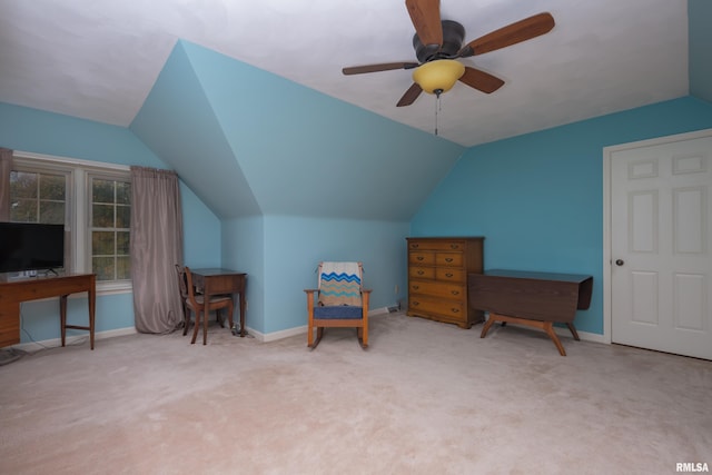 sitting room with ceiling fan, light colored carpet, and lofted ceiling