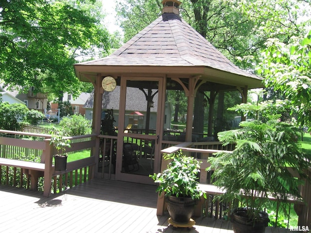 view of community with a gazebo and a wooden deck