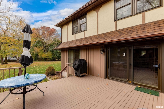 deck featuring a yard and area for grilling