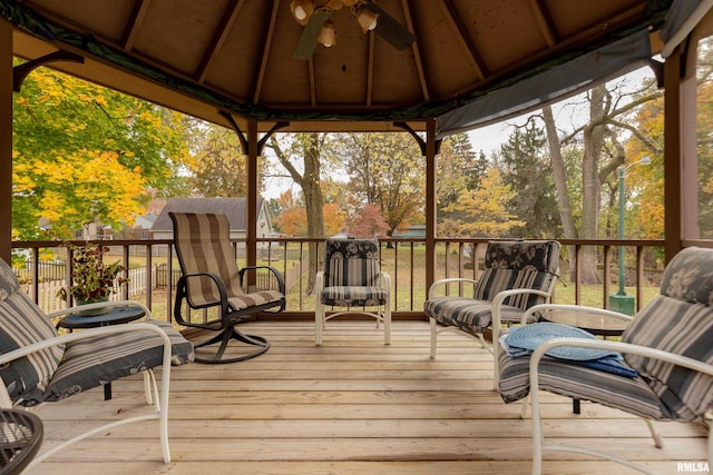 deck featuring a gazebo and ceiling fan