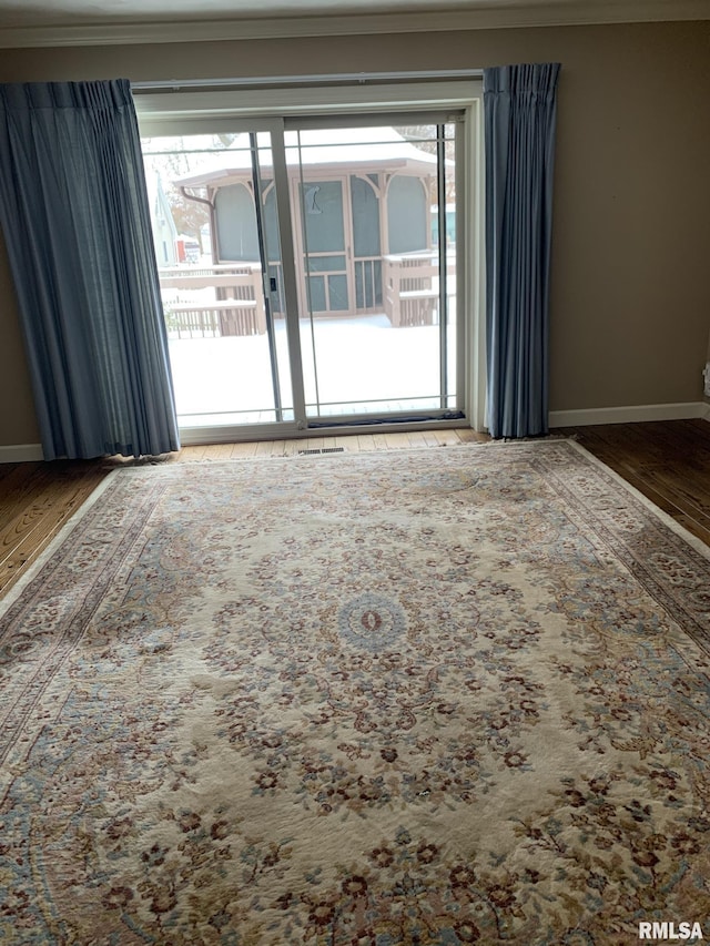 spare room with wood-type flooring