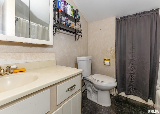 bathroom with vanity, curtained shower, toilet, and lofted ceiling