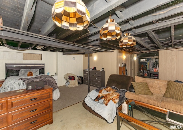 basement featuring wood walls