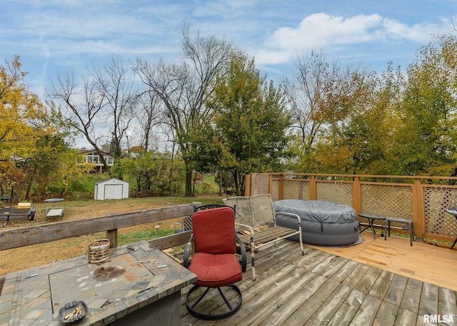 wooden deck with a storage shed