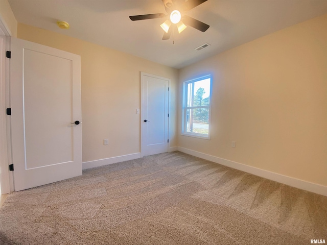 unfurnished bedroom featuring carpet flooring and ceiling fan