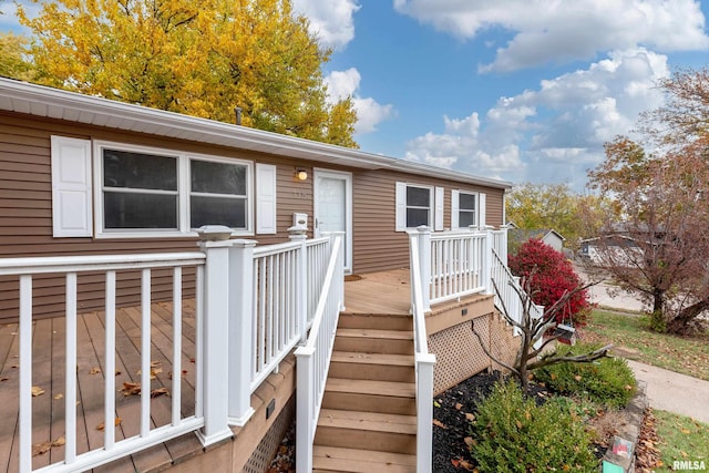 entrance to property with a wooden deck