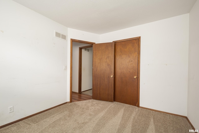 unfurnished bedroom with light carpet