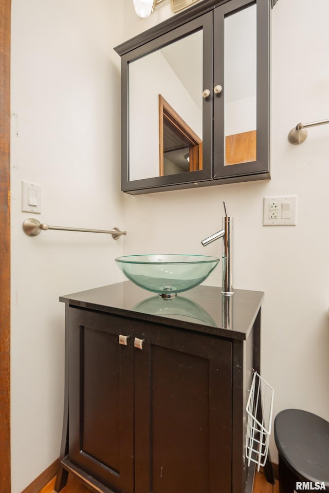 bathroom featuring vanity and hardwood / wood-style flooring