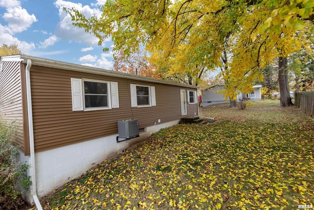 view of side of home with cooling unit