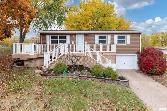 view of front of house with a deck and a garage