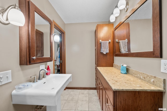 bathroom with sink and tile patterned floors