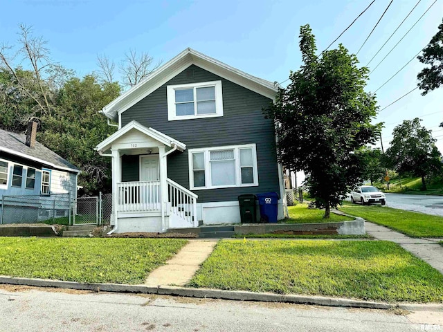 bungalow-style house with a front yard