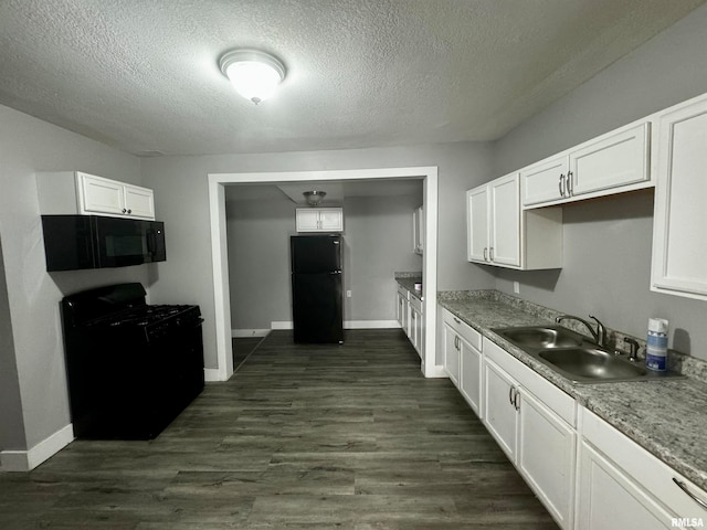 kitchen featuring black appliances, white cabinetry, a textured ceiling, sink, and dark wood-type flooring