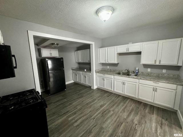 kitchen with sink, black appliances, a textured ceiling, white cabinets, and dark hardwood / wood-style flooring