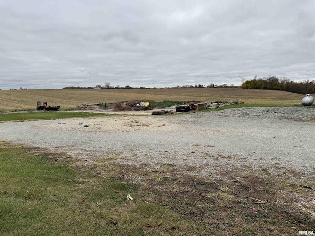 view of yard with a rural view