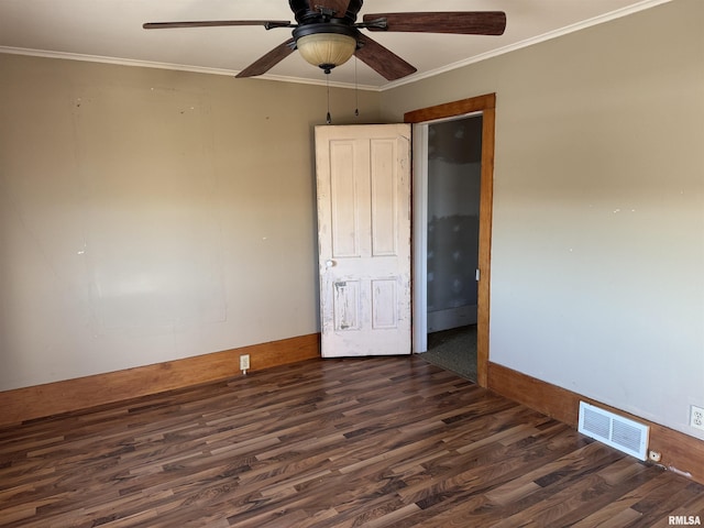 spare room with ceiling fan, dark hardwood / wood-style flooring, and ornamental molding