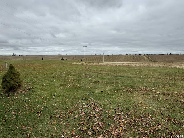 view of yard with a rural view