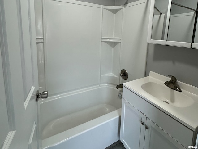 bathroom with vanity and  shower combination