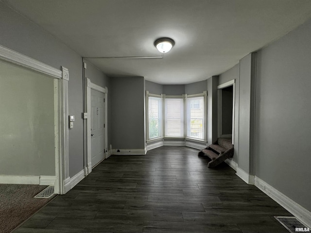 spare room featuring dark hardwood / wood-style floors