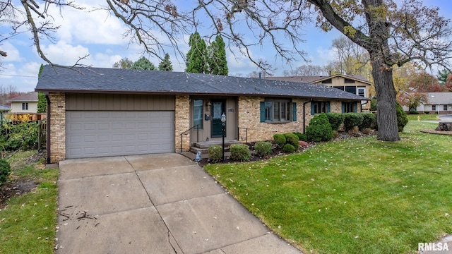 single story home featuring a garage and a front yard