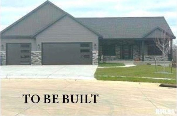 view of front of house with a garage and a front yard